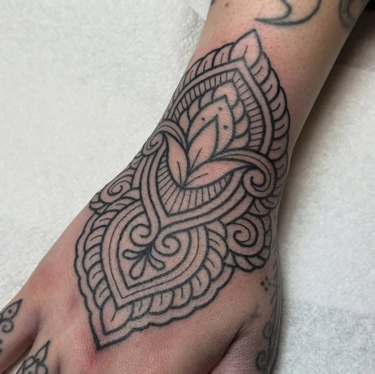 Medium Ornamental Mandala Floral Tattoo on Women Hand by @hermionetattoos