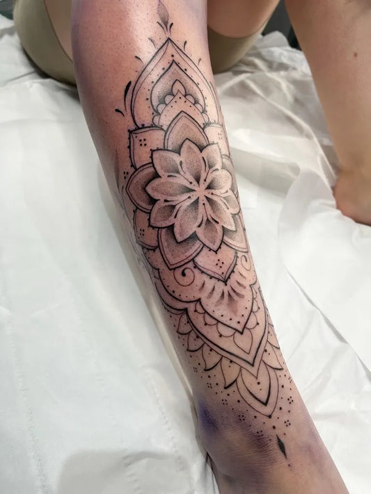 Medium Ornamental Mandala Flower Tattoo on Women Leg by @lakshmitattoos
