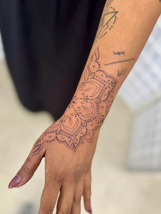 Medium Ornamental Mandala Tattoo on Women Wrist by @laurensmithtattoos