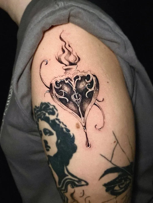 Medium Ornate Blackwork Heart and Flame on Women Arm Tattoo by @sire_emanuhell