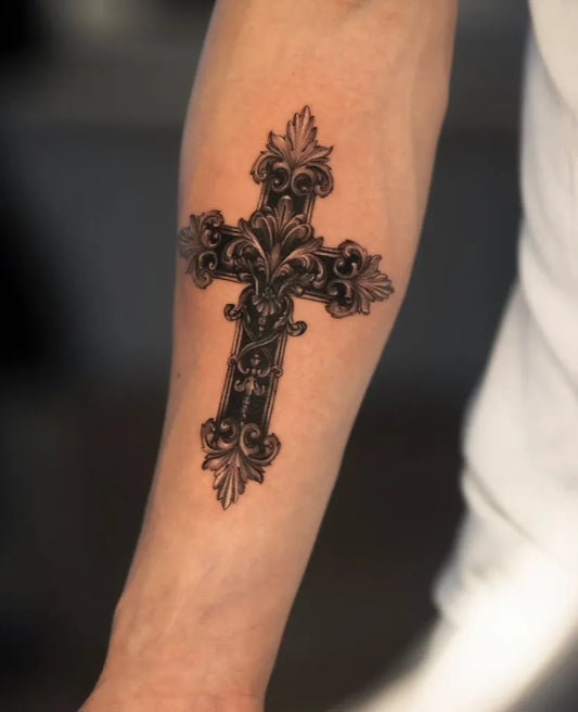Medium Ornate Cross on Men Arm Tattoo by @mstattooer