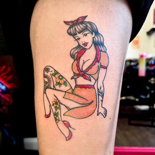 Medium Pinup Pin Up Girl Flowers Tattoo on Women Thigh by @ink_angel_tattoo_studio