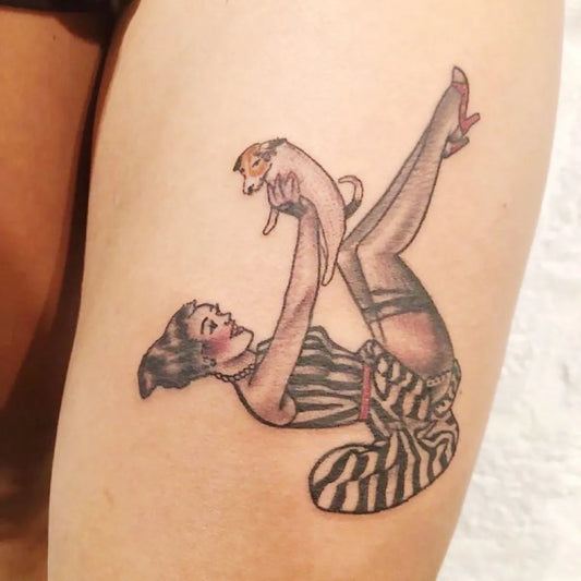 Medium Pinup Pin Up Girl with Dog Tattoo on Women Thigh by @lobster.tattoo