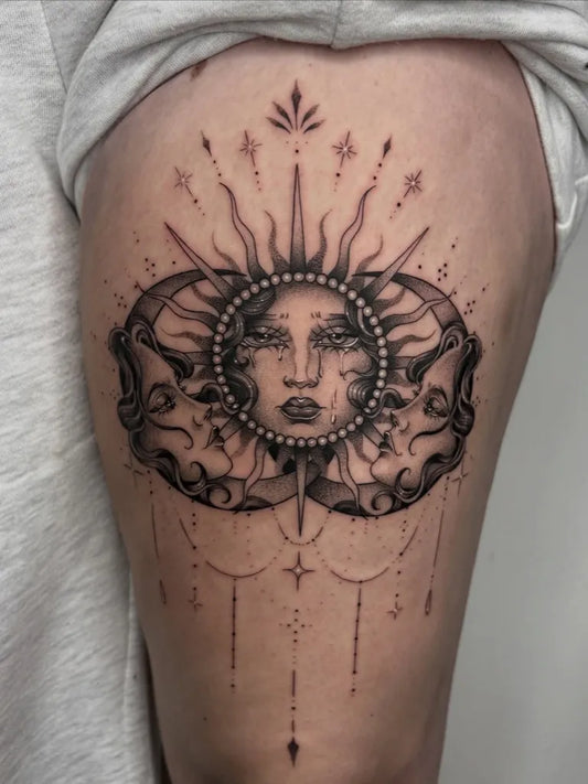 Medium Polynesian Sun Moon Faces Tattoo on Women Thigh by @megrobertstattoo