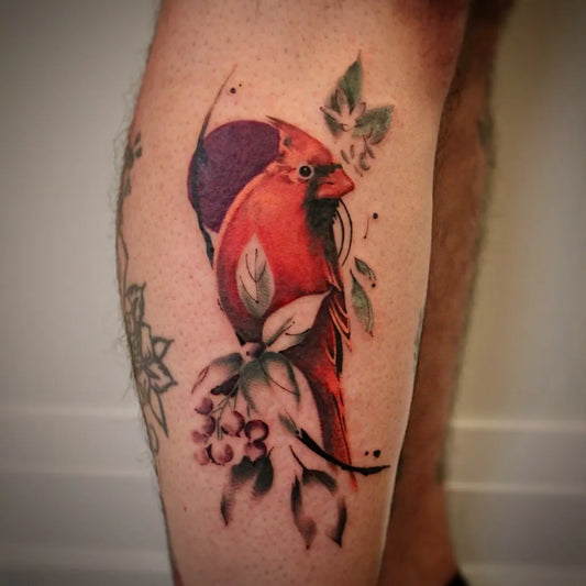 Medium Realism Cardinal Bird and Leaves Tattoo on Men Leg by @the.golden.siren