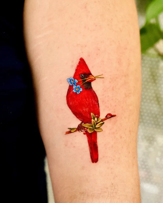 Medium Realism Cardinal with Forget Me Not and Branch Tattoo on Women Arm by @_rony_tattoo