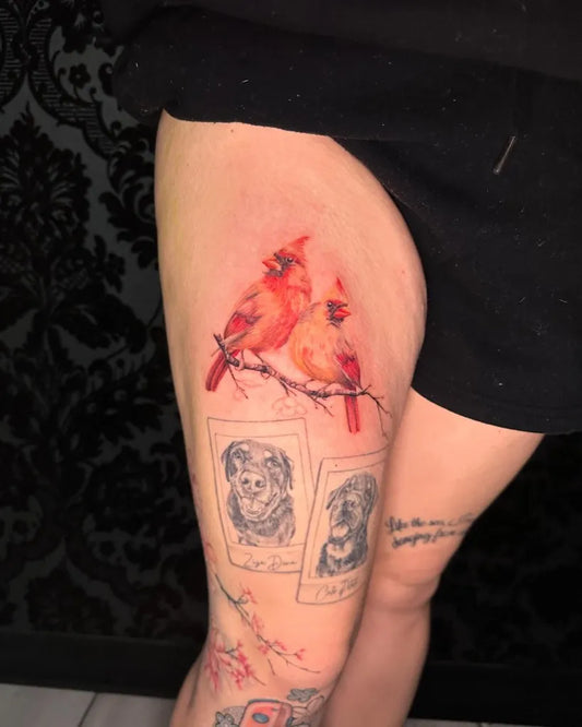 Medium Realism Cardinals and Labrador Tattoo on Women Thigh by @classy_cassitattoos