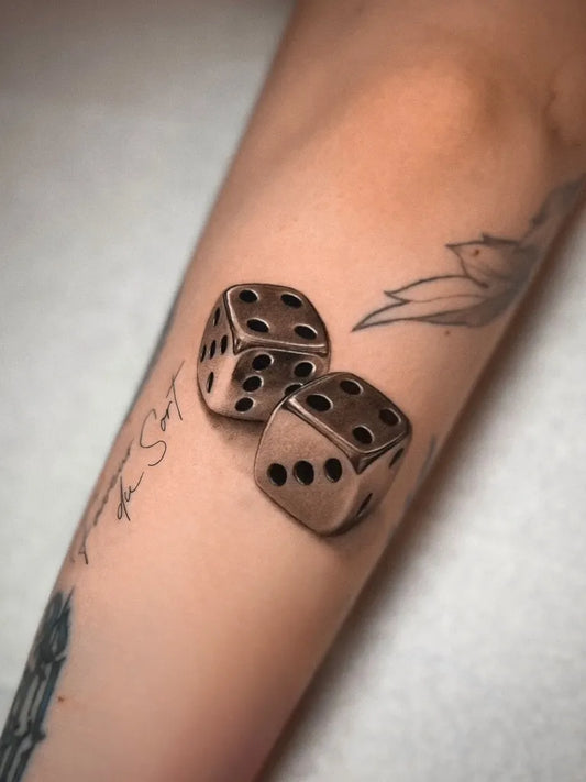 Medium Realism Dice Tattoo on Women Arm by @jaris_ink