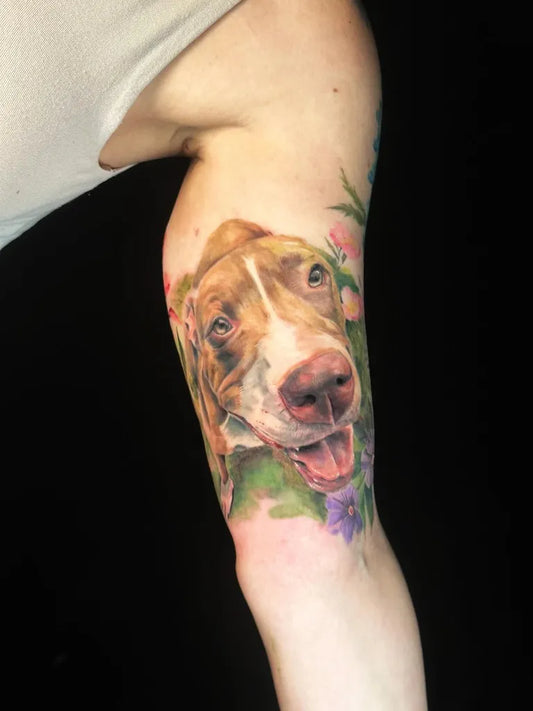 Medium Realism Dog with Flowers Tattoo on Women Arm by @assassintattooalice