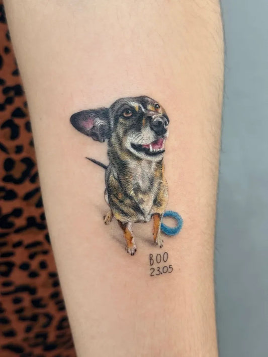 Medium Realism Dog with Toy Tattoo on Women Arm by @gabileilek