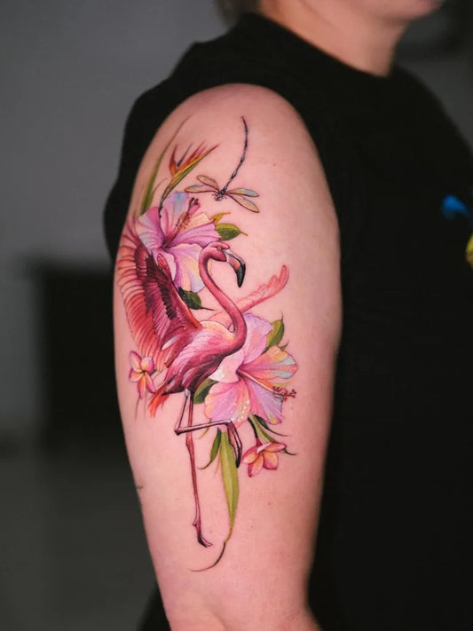 Medium Realism Flamingo and Hibiscus Tattoo on Women Arm by @zephyr.tattoo.madeira