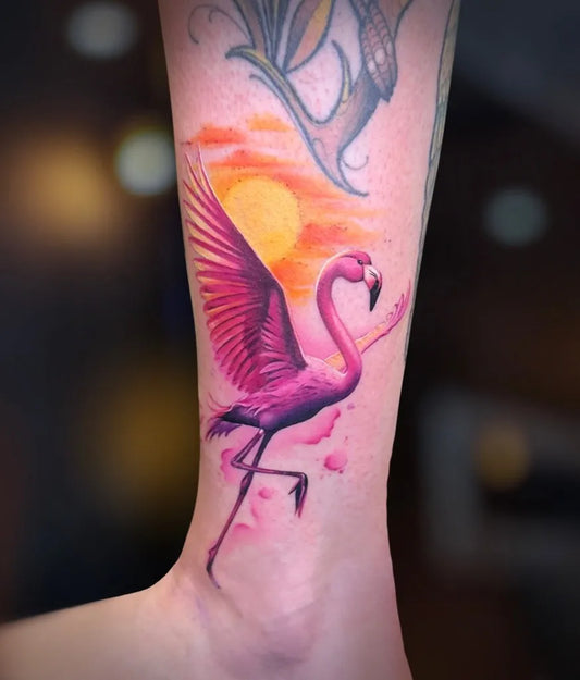 Medium Realism Flamingo with Sunset Wings Tattoo on Women Leg by @poliszka_tattoo