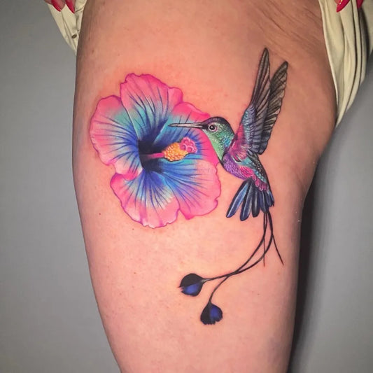 Medium Realism Hummingbird and Hibiscus Flower on Women Thigh Tattoo by @emilystewartist
