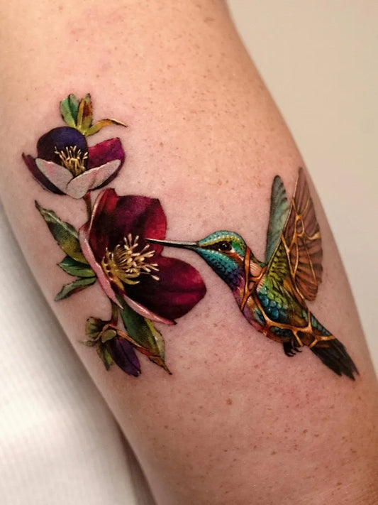 Medium Realism Hummingbird and Hibiscus Flowers on Women Arm Tattoo by @the.hancock.effect