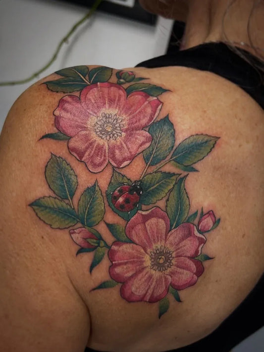 Medium Realism Ladybug and Roses Tattoo on Women Shoulder by @jhelgtattoos