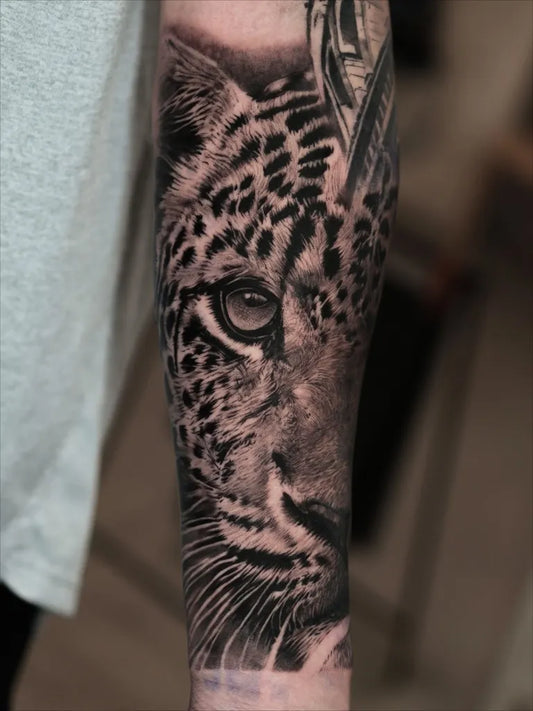 Medium Realism Leopard Tattoo on Men Arm by @tattooist_reset