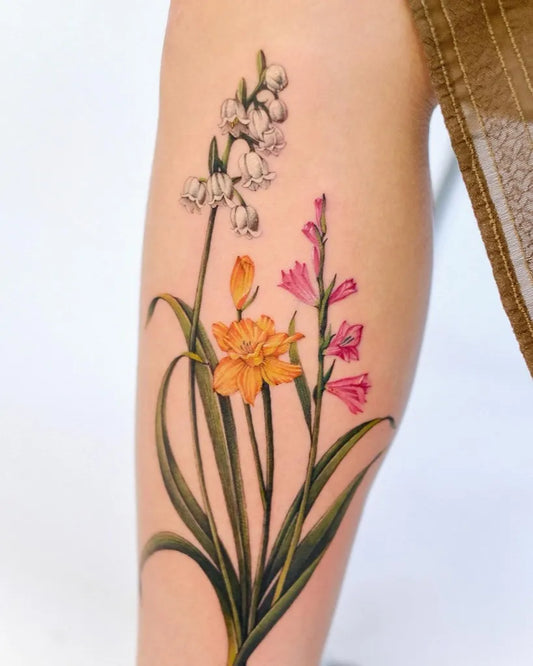 Medium Realism Lily of the Valley Daffodil Gladiolus on Women Leg Tattoo by @fancycrystal.tattoo