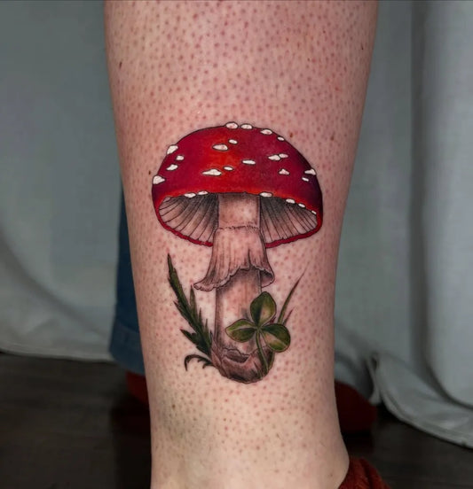 Medium Realism Mushroom with Clover on Women Leg Tattoo by @rachcollier_tattoo