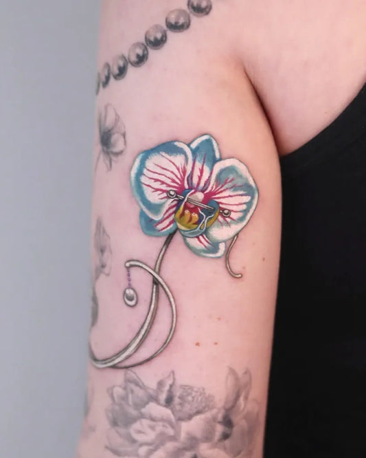 Medium Realism Orchid and Flowers Tattoo on Women Arm by @dani.dani_tt