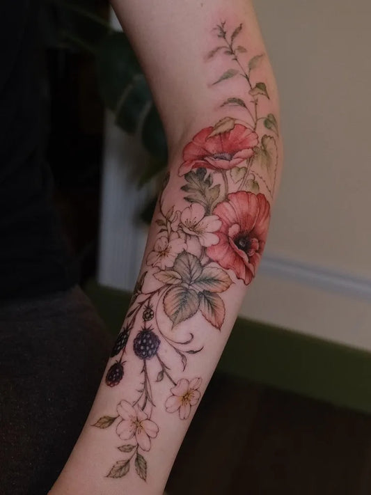 Medium Realism Poppy Flowers and Berries Tattoo on Women Arm by @mellyymae