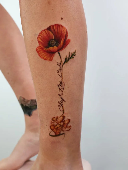 Medium Realism Poppy and Script Tattoo on Women Leg by @kravets.tattoo