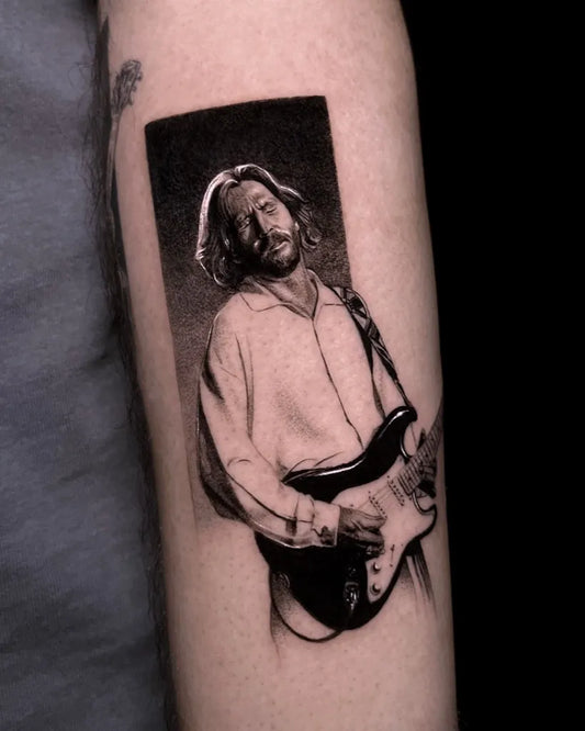 Medium Realism Portrait of Man Playing Guitar Tattoo on Men Arm by @kaplanarda