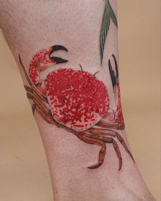 Medium Realism Red Crab Tattoo on Women Leg by @aliceink_tattoos