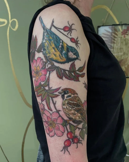 Medium Realism Sparrows and Rose Hips Tattoo on Women Arm by @kilo_alpha_tattoos