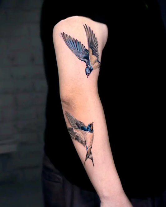 Medium Realism Swallow Tattoo on Men Arm by @dia_tattooist
