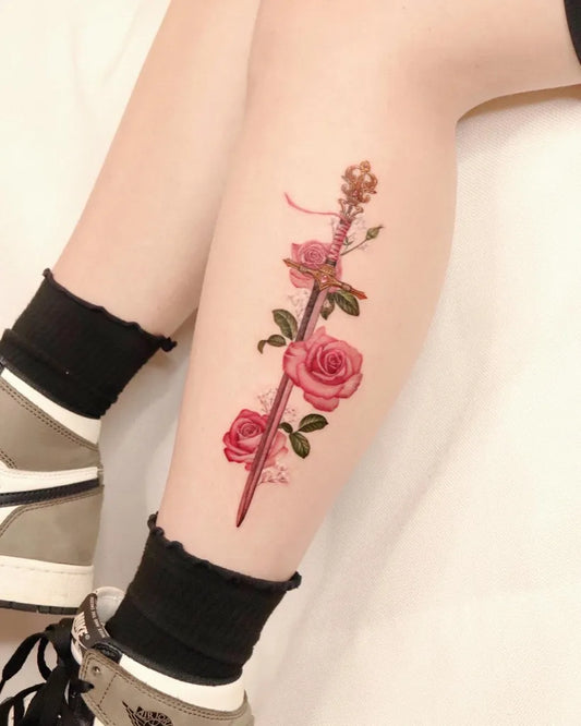 Medium Realism Sword with Roses Tattoo on Women Calf by @peria_tattoo