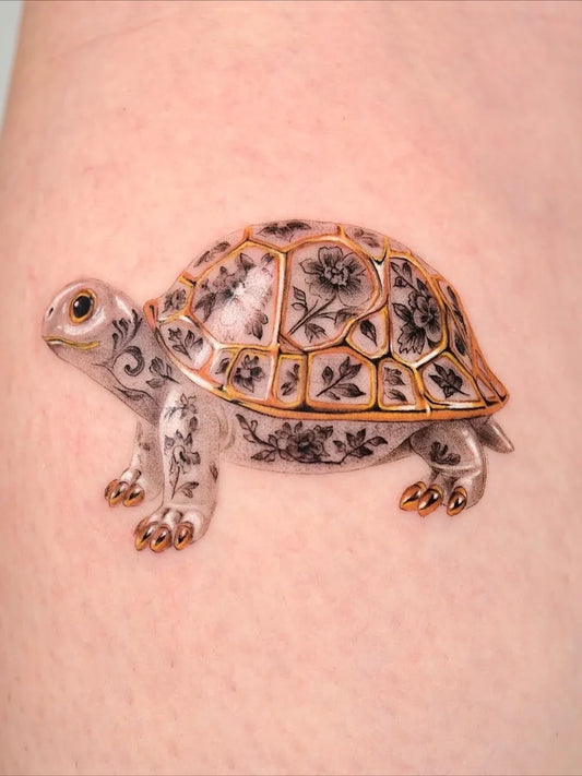 Medium Realism Turtle with Floral Shell Tattoo on Women Arm by @tattooer.ari