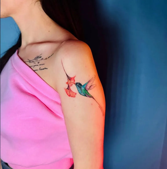 Medium Realistic Hummingbird with Flowers on Women Shoulder Tattoo by @tattoobyirem