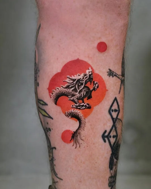 Medium Red Dragon Tattoo on Men Leg by @newtattoo_studio