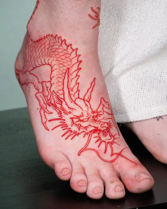 Medium Red Dragon Tattoo on Women Foot by @theartoftattooingofficial
