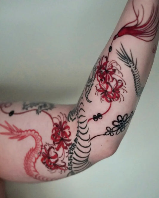 Medium Red Dragon and Higanbana Flowers Tattoo on Women Arm by @nana.orient