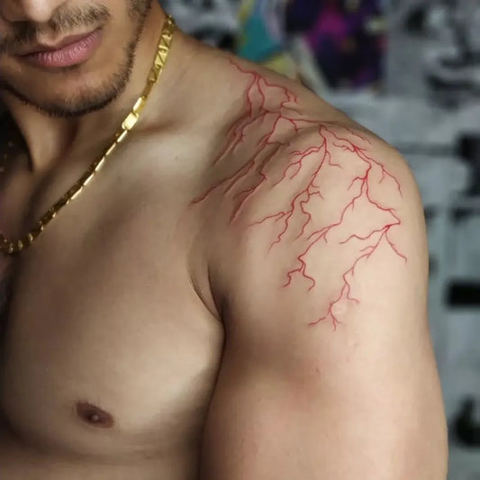 Medium Red Lightning Bolts Tattoo on Men Shoulder by @inkconnection_tattoo