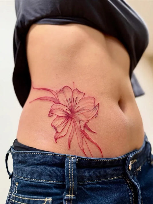 Medium Red Lily Tattoo on Women Side by @gerda_vilke_tattoo