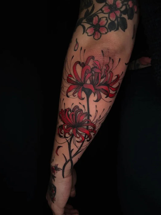 Medium Red RedSpiderLilies Tattoo on Women Arm by @labadah_ttt