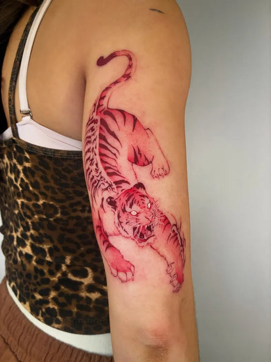 Medium Red Tiger Tattoo on Women Upper Arm by @tattooermin