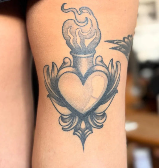 Medium Sacred Heart Flame Heart Wings on Women Thigh Tattoo by @benprescotttattoo