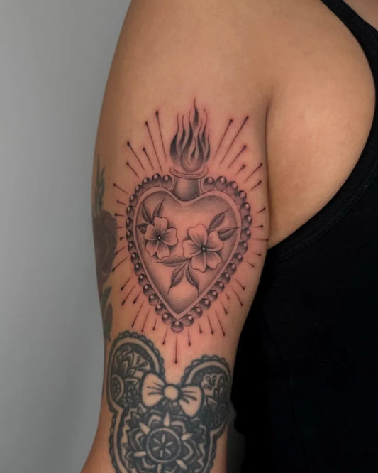 Medium Sacred Heart Heart with Flames and Flowers on Women Arm Tattoo by @mygodjose