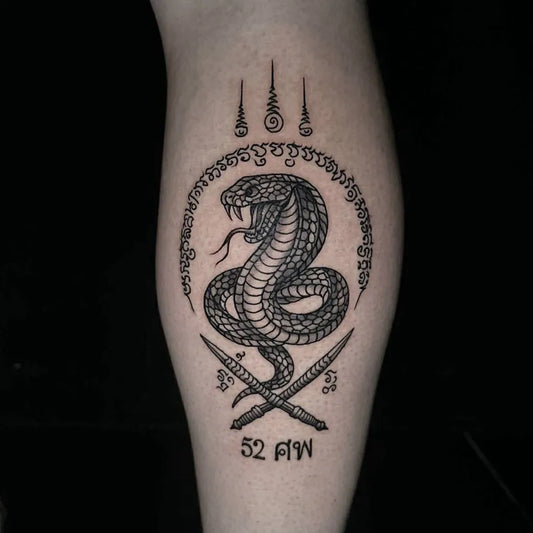 Medium Sak Yant Cobra SakYant Tattoo on Men Leg by @kayotattoophuketthailand