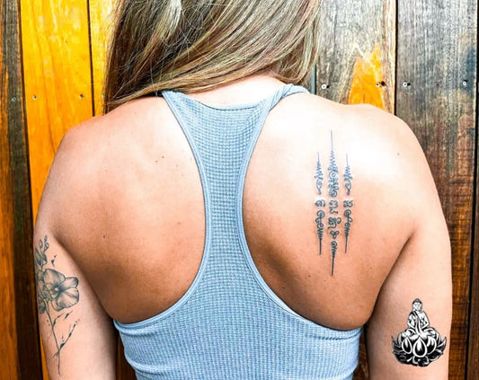 Medium Sak Yant Sak Yant Script Tattoo on Women Back by @bambootattoosamui