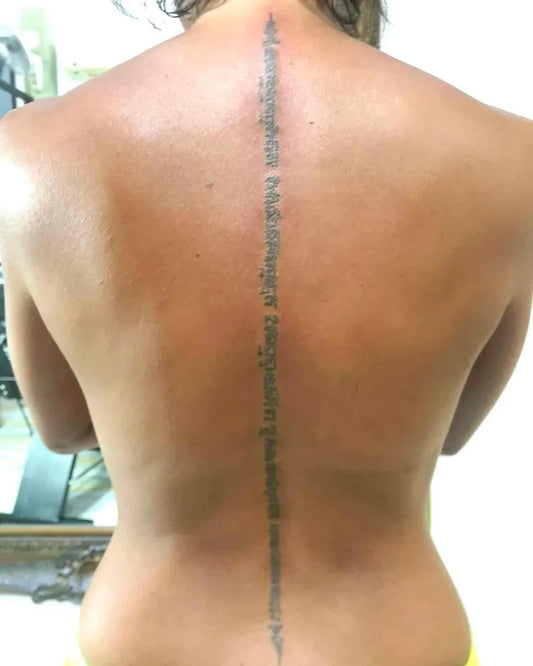 Medium Sak Yant Script Tattoo on Women Back by @thebambooroomssamui