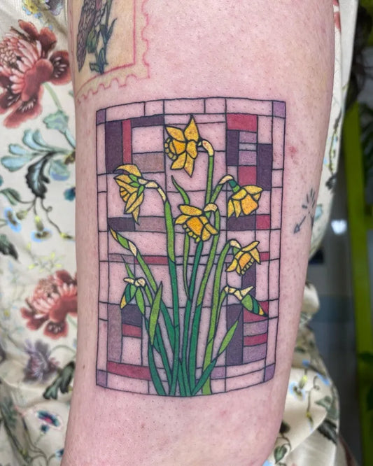 Medium Stained Glass Daffodil Tattoo on Women Arm by @emilys_tattoo_parade