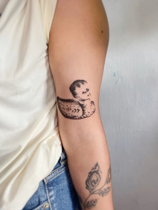 Medium Stick and Poke Duck Tattoo on Women Arm by @streetspirit.poke