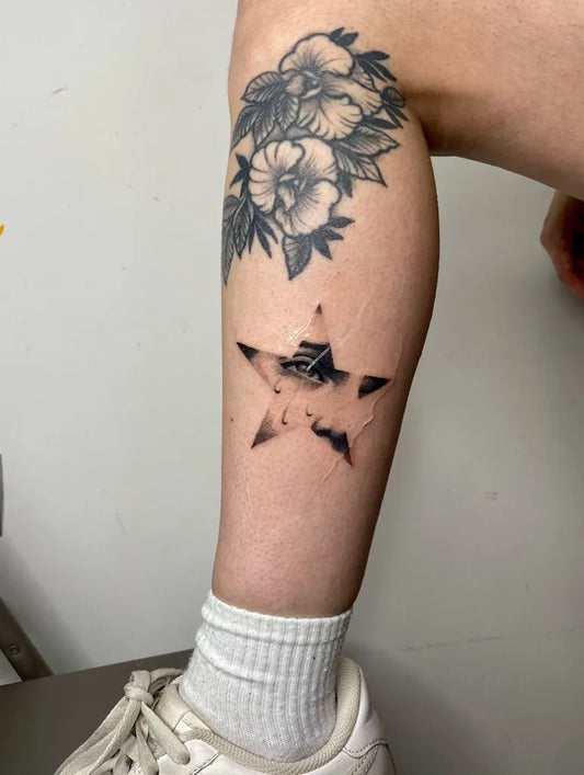 Medium Stick and Poke Hibiscus Flower and Star Tattoo on Women Thigh by @handpouc