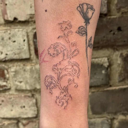 Medium Stick and Poke Rose and Vines Tattoo on Women Arm by @siilvester