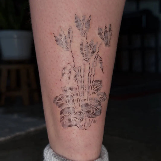 Medium Stick and Poke Violet Plant Tattoo on Women Leg by @olyviastattoos