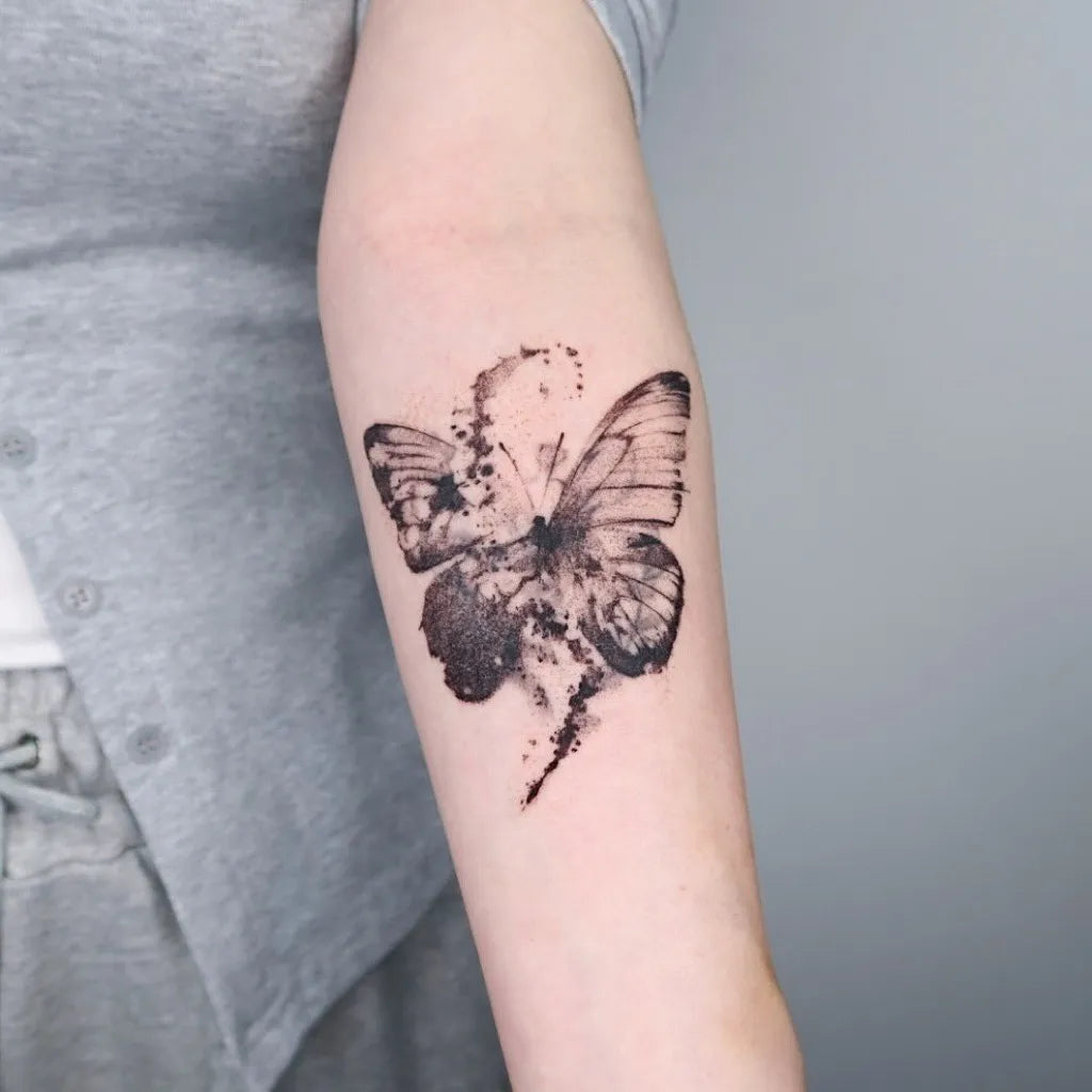 Surrealism Butterfly on Women Upper Arm Tattoo by @crowbk